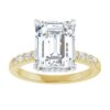moissanite ring in yellow and white gold with accent diamonds